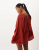 Petite Cape Sleeve Open Back Mini Dress With Tassels In Rust