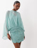 Caped Open Back Mini Dress With Embellished Skirt In Turquoise