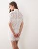 Noughts & Kisses Lace High Neck Padded Shoulder Mini Dress In White