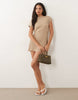 Knitted Cinched Pleated Mini Dress In Stone